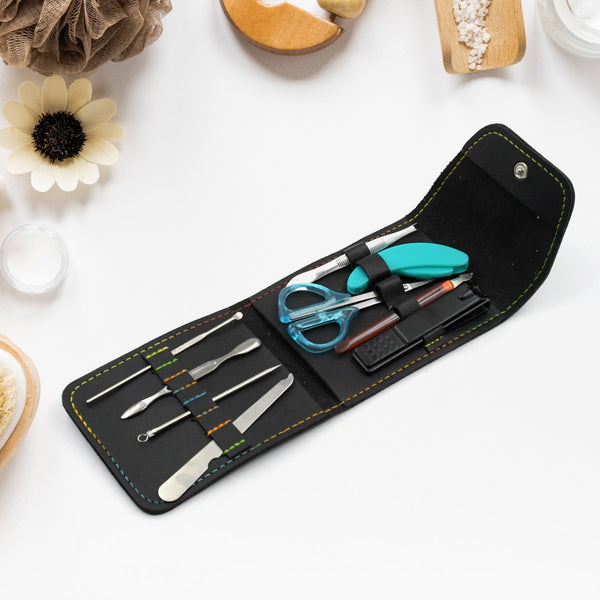 9-piece nail clipper kit with stainless steel tools in a travel case