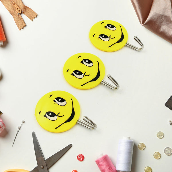 Self-adhesive smiley face hooks