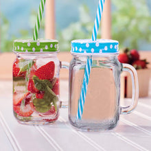 Drinking jar with handle and straw, suitable for smoothies and cold drinks.